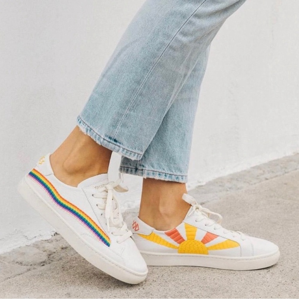 Soludos White Low-Top Sneakers with Rainbow Stripe and Yellow Sunburst
